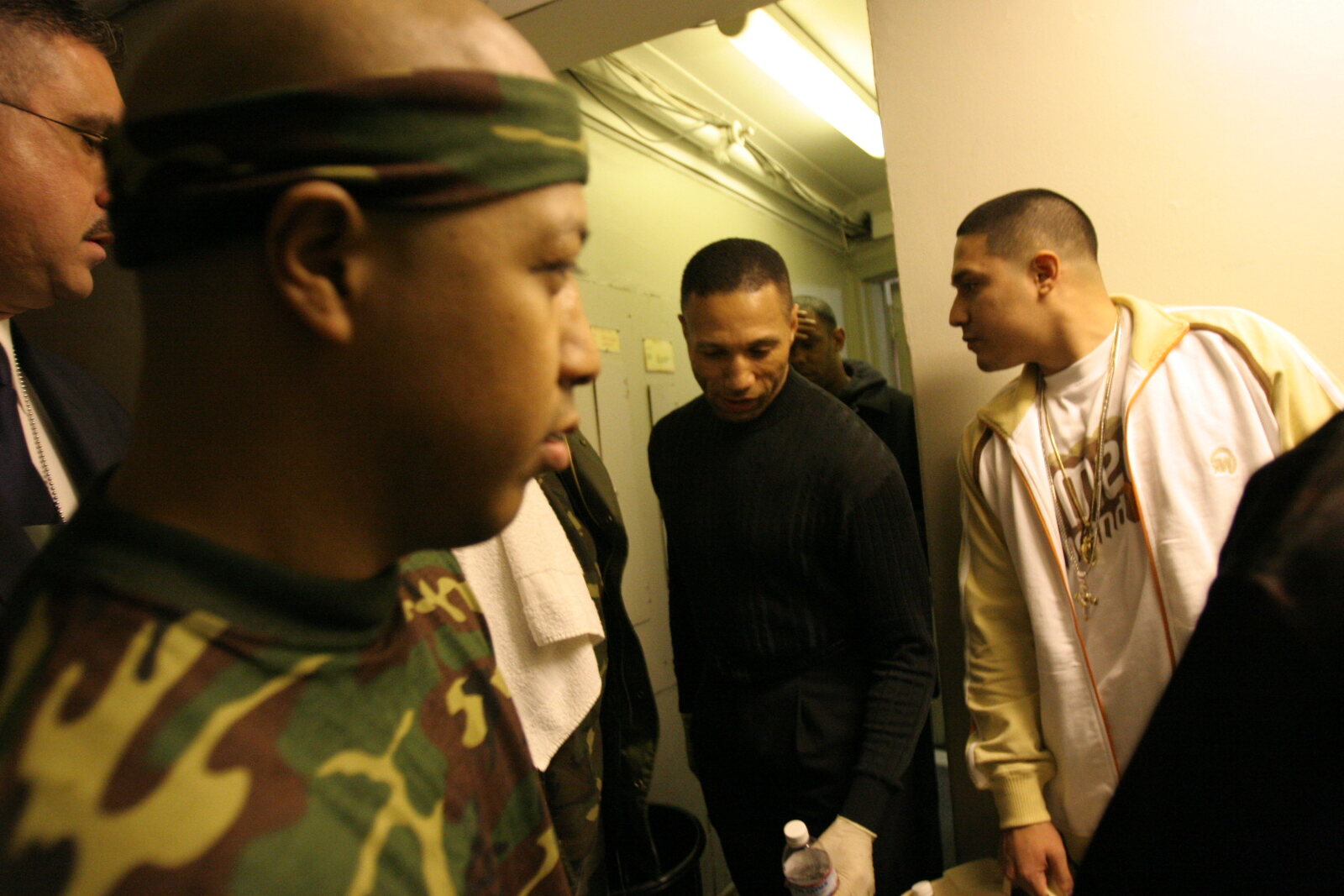 Coach Wacho with fighters during a professional boxing event