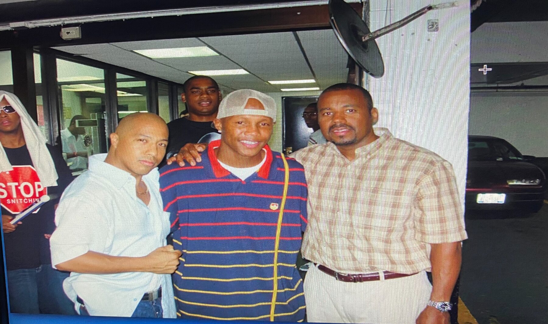 Coach Wacho with members of the boxing community
